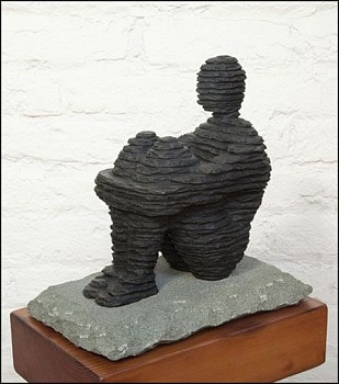 Boaz Vaadia Haggay (BVE) (2020), a bronze and bluestone sculpture, depicting a seated, layered stone figure on a rectangular base. A contemporary sculptural work showcasing Vaadiaâ€™s connection to nature and materiality. Available at Sponder Gallery.