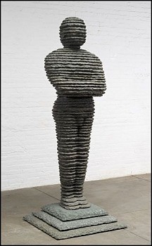 Boaz Vaadia David (#109) (2012), bronze and bluestone sculpture, 91 x 36 x 36 inches. A standing figure, sculpted using Vaadiaâ€™s signature stacked stone technique, embodying the connection between humanity and nature.