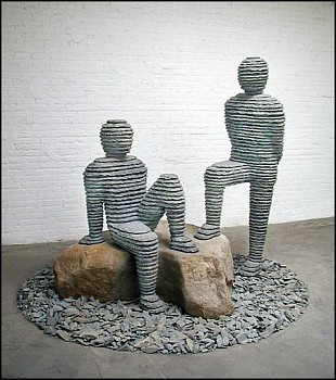 Boaz Vaadia Asaf and Yo'ah (#68) (2001), a bronze and bluestone sculpture depicting two stacked-stone human figures interacting with boulders. A striking example of modern figurative sculpture using natural materials, available at Sponder Gallery.