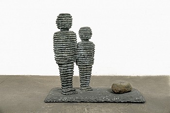 Boaz Vaadia Milka and Tirza (#2) (1990), bronze, bluestone, and boulder sculpture, 41 x 47 x 24 inches. Two stacked stone figures stand closely together, reflecting Vaadiaâ€™s inspiration from ancient stonework and natural formations.