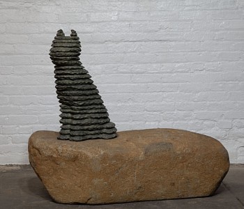 Boaz Vaadia Cat (2007), a bronze and boulder sculpture depicting a seated cat in a stacked-stone formation, blending nature and art. A striking modern sculpture available at Sponder Gallery.