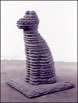Boaz Vaadia Dog (#61) (2001), a bronze and bluestone figurative sculpture featuring a seated dog, measuring 34 x 27 x 23 inches. This stacked stone artwork merges ancient techniques with modern abstraction, available at Sponder Gallery.