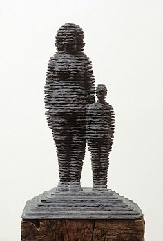Boaz Vaadia Sara and Yizhaq (1986), a bronze and bluestone figurative sculpture featuring a standing adult figure and child, measuring 19 x 12 x 10 inches. This stacked stone artwork merges ancient techniques with modern abstraction, available at Sponder