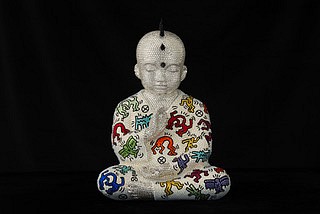 Metis Atash, Soul Sync, 2025
Resin, acrylic paint and 28,000 Swarovski crystals, 17 x 12 x 7 in.
A cast resin Punk Buddha sculpture with imagery inspired by Keith Haring created using over 28,000 swarovski crystals 
ATAS00262