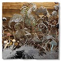 Jill Hotchkiss, Winter
2026, genuine silver and copper leaf, gold leaf, fire-charred and carved cedar wood